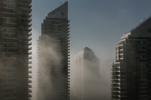 smog against tall residential towers in toronto