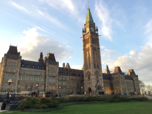 image of parliament hill building under blue sky with clouds