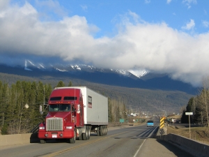front shot of an semi truck driving on a north american highway