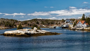 photograph of several houses along the coastline in Nova Scotia