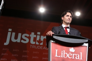 image of trudeau speaking in front of press at his election campaign in 2015