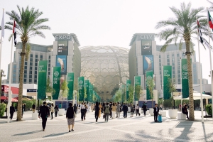 photograph of COP28 pavilion with delegates walking towards the entrance