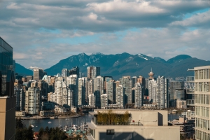 photograph of downtown vancouver against mountains