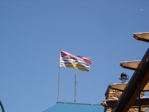 image of bc flag waving on building roof